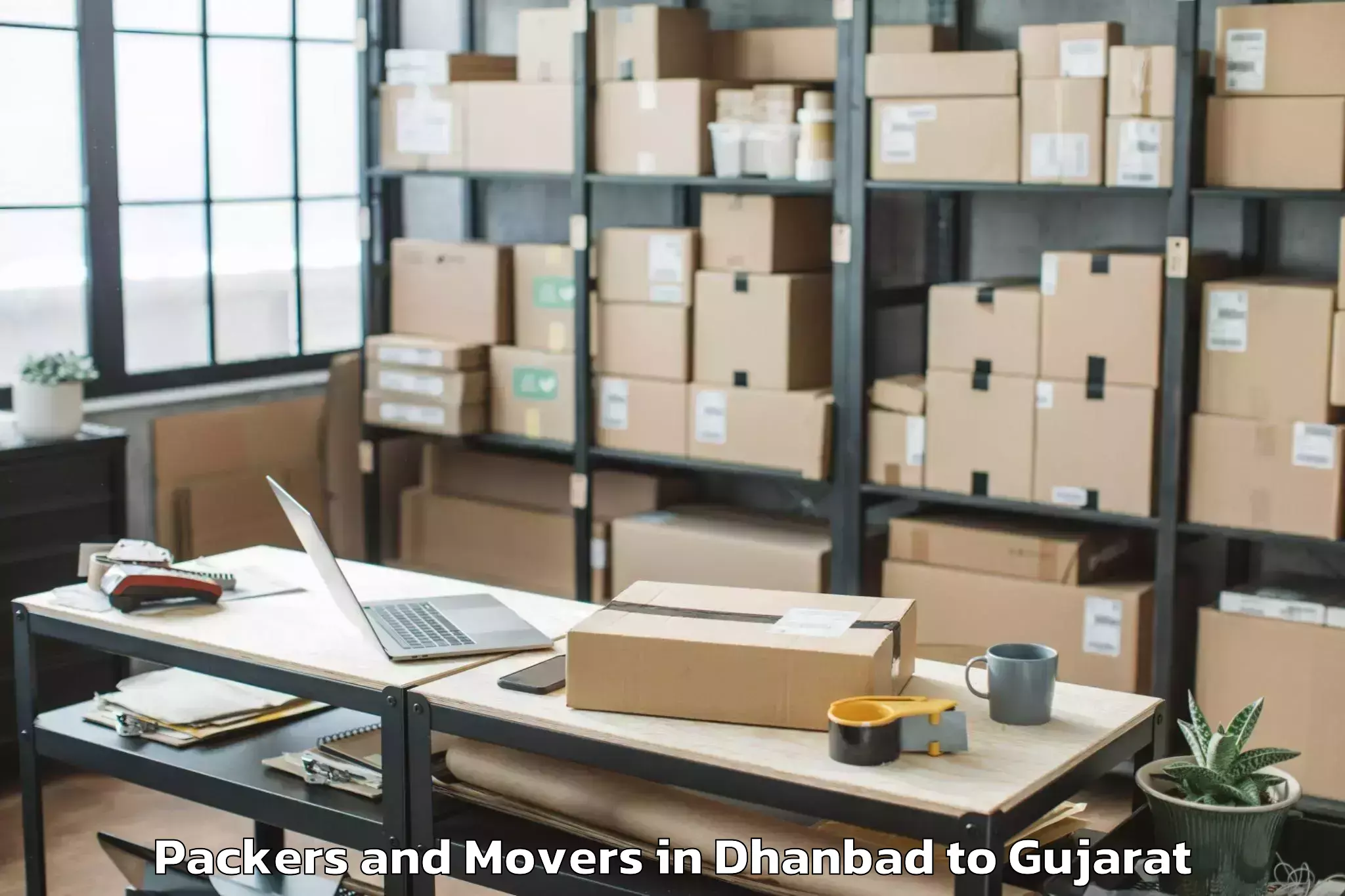 Reliable Dhanbad to Visavadar Packers And Movers